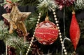 Red decoration on Christmas tree. Royalty Free Stock Photo