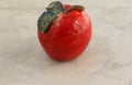 Red decorative ceramic apple on table