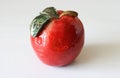 Red decorative ceramic apple on table