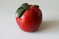 Red decorative ceramic apple on table