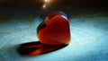 Red Decorative Glass Heart Spotlighted From Above