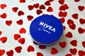 Nivea cream product on a red hearts white background