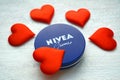 Nivea cream product and red hearts white background Royalty Free Stock Photo