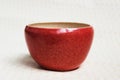 Red deep bowl for food. handmade ceramics. made on a potter`s wheel