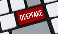 Red deepfake button on computer keyboard. Concept of artificial intelligence deception and media manipulation Royalty Free Stock Photo