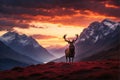 Red deer stag in dramatic mountain landscape and red sky Royalty Free Stock Photo