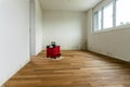 Red dehumidifier in an empty room with a toxic mold and mildew problem Royalty Free Stock Photo