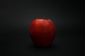 Red apple on a black background