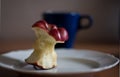 Red delicious Bitten apple on the plate