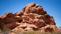 Desert rocks under bright sun against clear blue sky Royalty Free Stock Photo