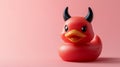 Red devil rubber duck on a pink background Royalty Free Stock Photo