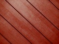 Red diagonal interior design wooden slat wall wood panel designer decor closeup painted background