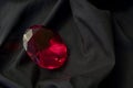 Red diamond on black satin Royalty Free Stock Photo