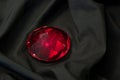 Red diamond on black satin Royalty Free Stock Photo