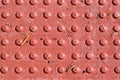 Red diamond plate closeup texture with dirt and grime Royalty Free Stock Photo
