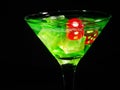 Red dice in a cocktail glass on black background. casino series Royalty Free Stock Photo