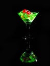 Red dice in a cocktail glass on black background. casino series Royalty Free Stock Photo