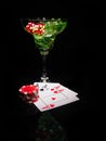 Red dice and a cocktail glass on black background. casino series Royalty Free Stock Photo