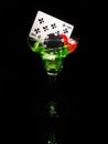 Red dice and a cocktail glass on black background. casino series Royalty Free Stock Photo