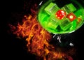 Red dice in a cocktail glass on Fire background. casino series Royalty Free Stock Photo