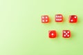 Red dice lying on a green background Royalty Free Stock Photo