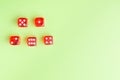 Red dice lying on a green background. from above. copy space Royalty Free Stock Photo