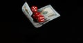 Red Dice rolling on Dollar Bills against Black Background Royalty Free Stock Photo