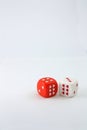 A red dice and a white dice with hearts on their faces Royalty Free Stock Photo