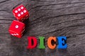 Red dice word on a wooden table