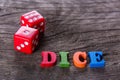 Red dice word on a wooden table