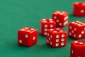 Red dices on green poker gaming table in casino. Concept online gambling Royalty Free Stock Photo