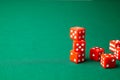 Red dices on green poker gaming table in casino. Concept online gambling. Copy space for text Royalty Free Stock Photo