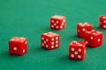 Red dices on green poker gaming table in casino. Concept online gambling Royalty Free Stock Photo