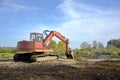 Red digger in nature Royalty Free Stock Photo