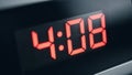 Red Digital Clock Display Shows 4:08 AM PM - Close-up on Timekeeping Device Royalty Free Stock Photo