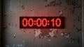 Red digital countdown timer displaying 10 seconds on old cracked wall Royalty Free Stock Photo