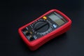 Red digital multimeter with on black Royalty Free Stock Photo
