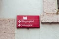 Red directional sign on a street in Wurzburg, Germany