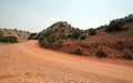 Red dirt and gravel Crooked Creek Road through the Pryor Mountains in Wyoming Royalty Free Stock Photo