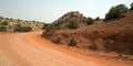 Red dirt and gravel Crooked Creek Road through the Pryor Mountains in Wyoming Royalty Free Stock Photo