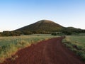 A Red Dirt Road Leading to Capulin Volcano in New Mexico Royalty Free Stock Photo