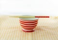 Red dish and chopsticks with oriental style Royalty Free Stock Photo