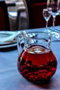 Red dogwood compote in a transparent decanter