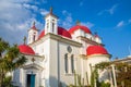 The red-domed Greek Orthodox church of the Twelve Apostles near the shore of the Sea of Galilee at Capernaum, Israel Royalty Free Stock Photo