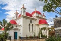 The red-domed Greek Orthodox church of the Twelve Apostles near the shore of the Sea of Galilee at Capernaum, Israel Royalty Free Stock Photo