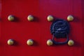 Red door with brass nails Royalty Free Stock Photo