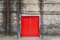 Red door on brick building Royalty Free Stock Photo