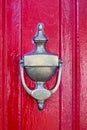 Red Door with bronze door-knocker