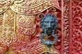 Door handle with lion design on buddhist temple Royalty Free Stock Photo