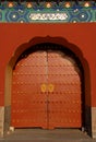 A red door with Chinese decoration at the Temple of Heaven in Beijing, China. Known as Tiantan in Chinese. Royalty Free Stock Photo